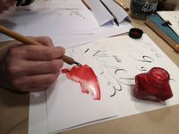 Kalligrafie mit roter Tusche